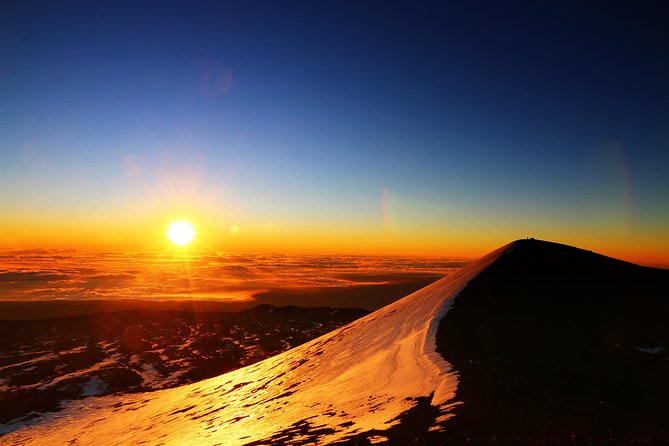 Big Island: Mauna Kea Summit Tour with Free Night Star Photo - Sunset above the clouds