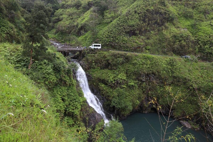 Road to Hana: Professional Guide, Food, Swimming, Waterfalls - Food stands, banana bread, and cash